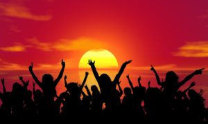 dancing people sunset